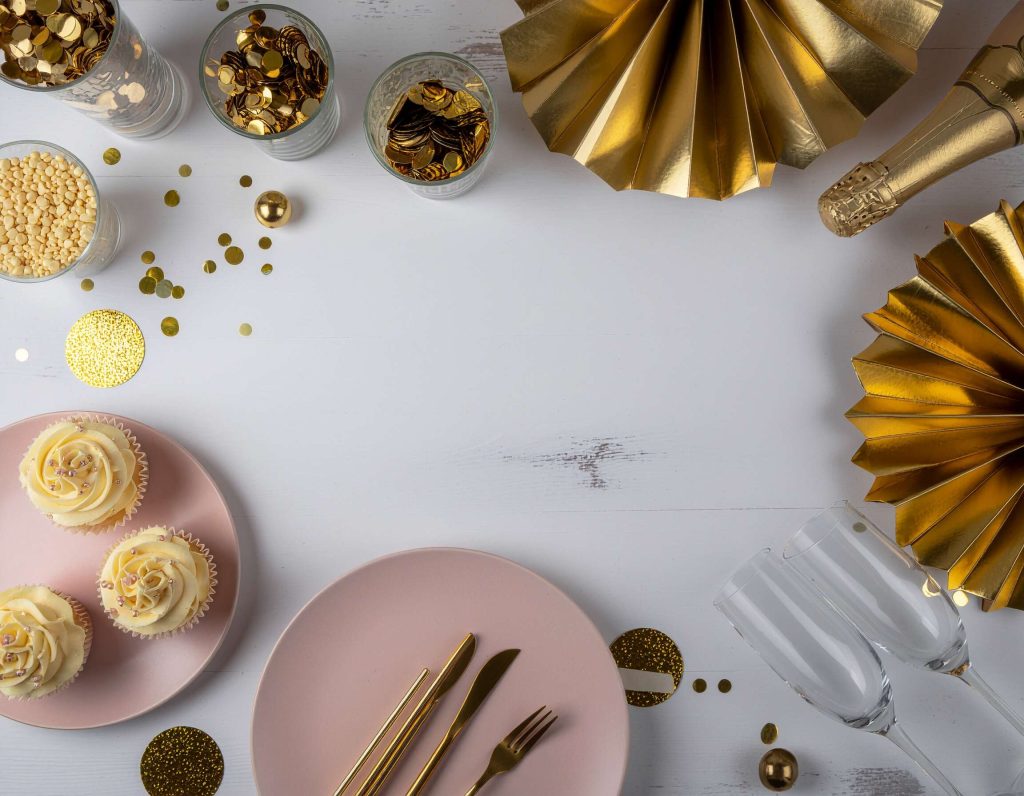 styled bridal shower table pink and gold palette, gold confetti poppers in vases